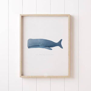 Minimalist blue whale print with the phrase 'we whaley love you,' ideal for nursery or coastal decor.